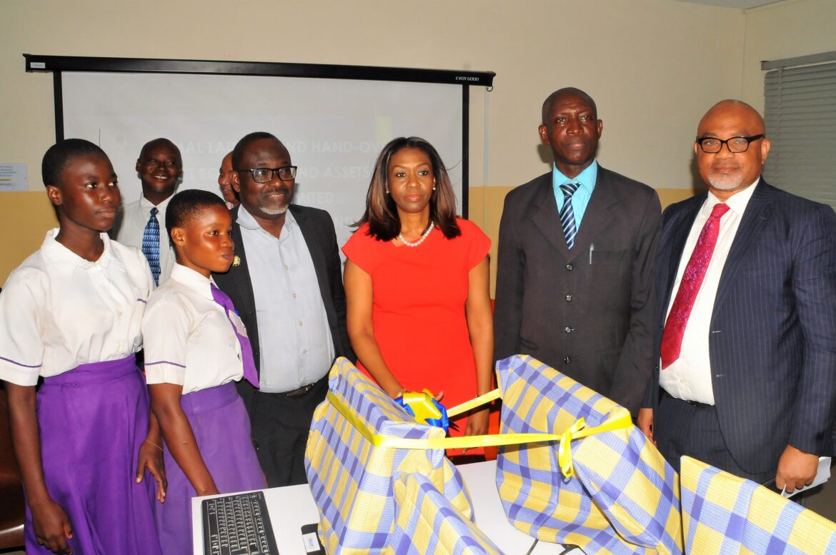 Managing Director/CEO, SecureID Limited, Mrs. Kofo Akinkugbe (3rd right), flanked by Principal, Ajumoni Senior Secondary School, Mushin, Mr. Benson Megbowon (2ND right); Board Director, SecureID Limited, Mr. Adeyinka Adeyemi (1ST right); Director, Schools Administration, Education District 6, Ministry of Education, Lagos State, Mr. Olubunmi Olukoya (3rd left) and students of Ajumoni Senior Secondary School, Mushin, at the CSR Launching and Hand-over of ICT Equipment and Assets donated by SecureID Limited to Ajumoni Senior Secondary School, Iyana-Isolo, Mushin, A Lagos State Government Secondary School.