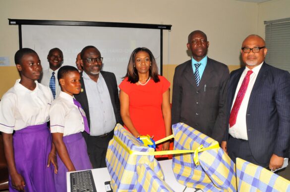 Managing Director/CEO, SecureID Limited, Mrs. Kofo Akinkugbe (3rd right), flanked by Principal, Ajumoni Senior Secondary School, Mushin, Mr. Benson Megbowon (2ND right); Board Director, SecureID Limited, Mr. Adeyinka Adeyemi (1ST right); Director, Schools Administration, Education District 6, Ministry of Education, Lagos State, Mr. Olubunmi Olukoya (3rd left) and students of Ajumoni Senior Secondary School, Mushin, at the CSR Launching and Hand-over of ICT Equipment and Assets donated by SecureID Limited to Ajumoni Senior Secondary School, Iyana-Isolo, Mushin, A Lagos State Government Secondary School.